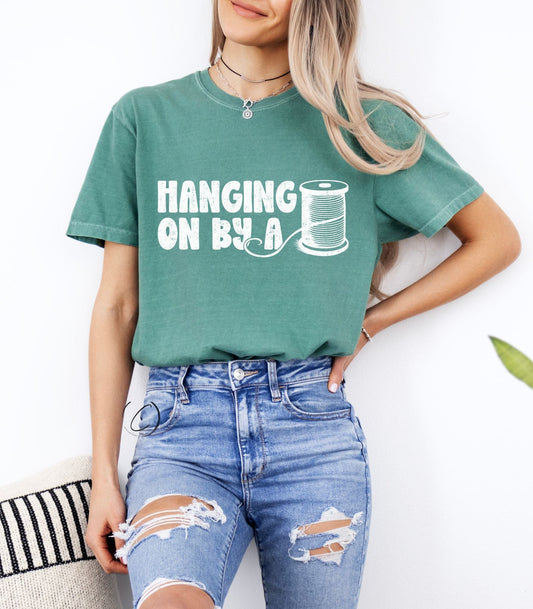 Hanging On By A Thread Graphic Tee
